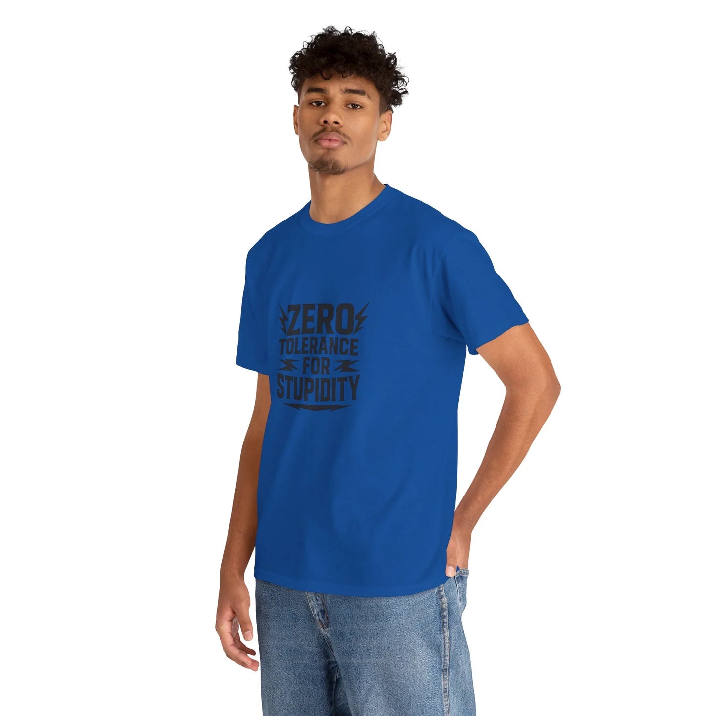 Man wearing royal blue graphic tee with zero tolerance for stupidity slogan, casual jeans