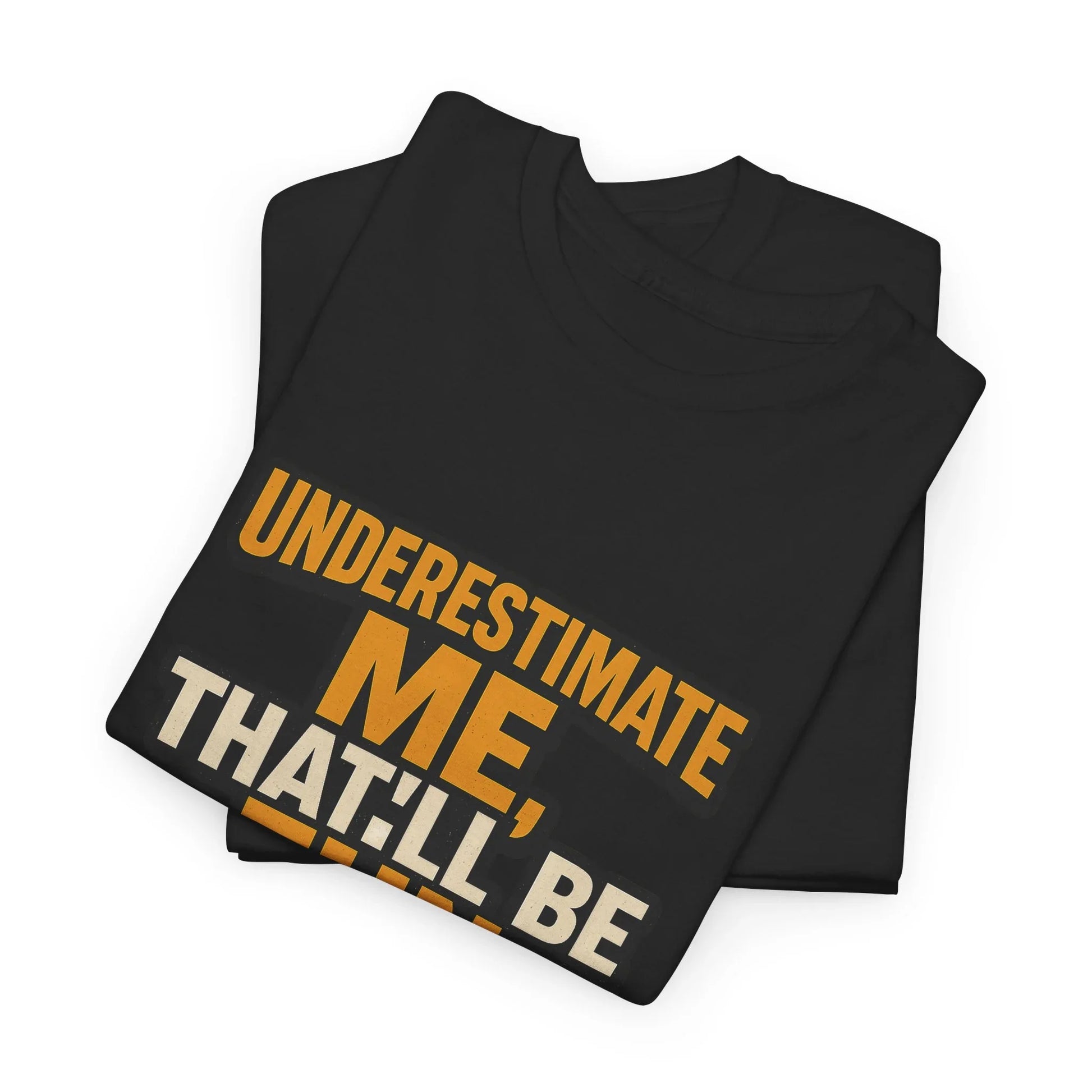 Folded black graphic t-shirt with bold orange and white text 'UNDERSTIMATE ME, THAT’LL BE'.