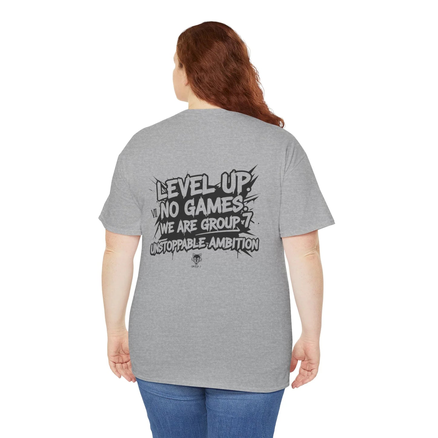 Woman wearing gray graphic t-shirt with 'Level Up, No Games, Unstoppable Ambition' print