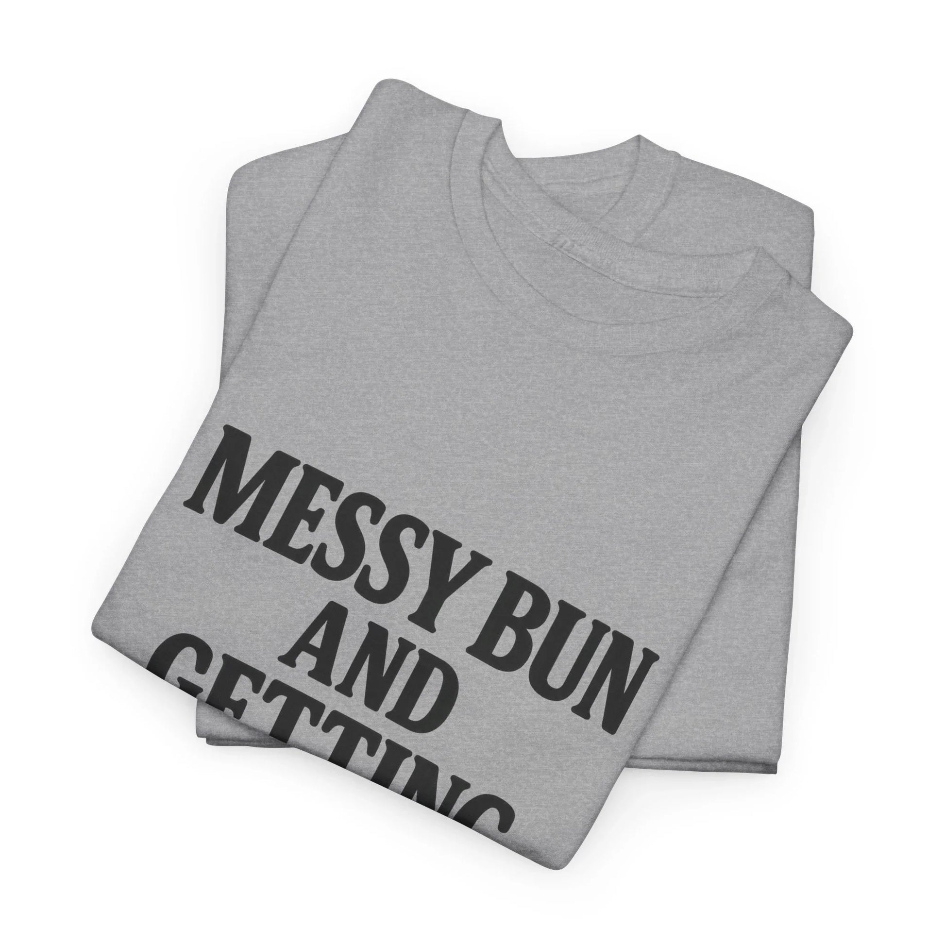 Folded gray graphic t-shirt with black text saying 'MESSY BUN AND' on a white background