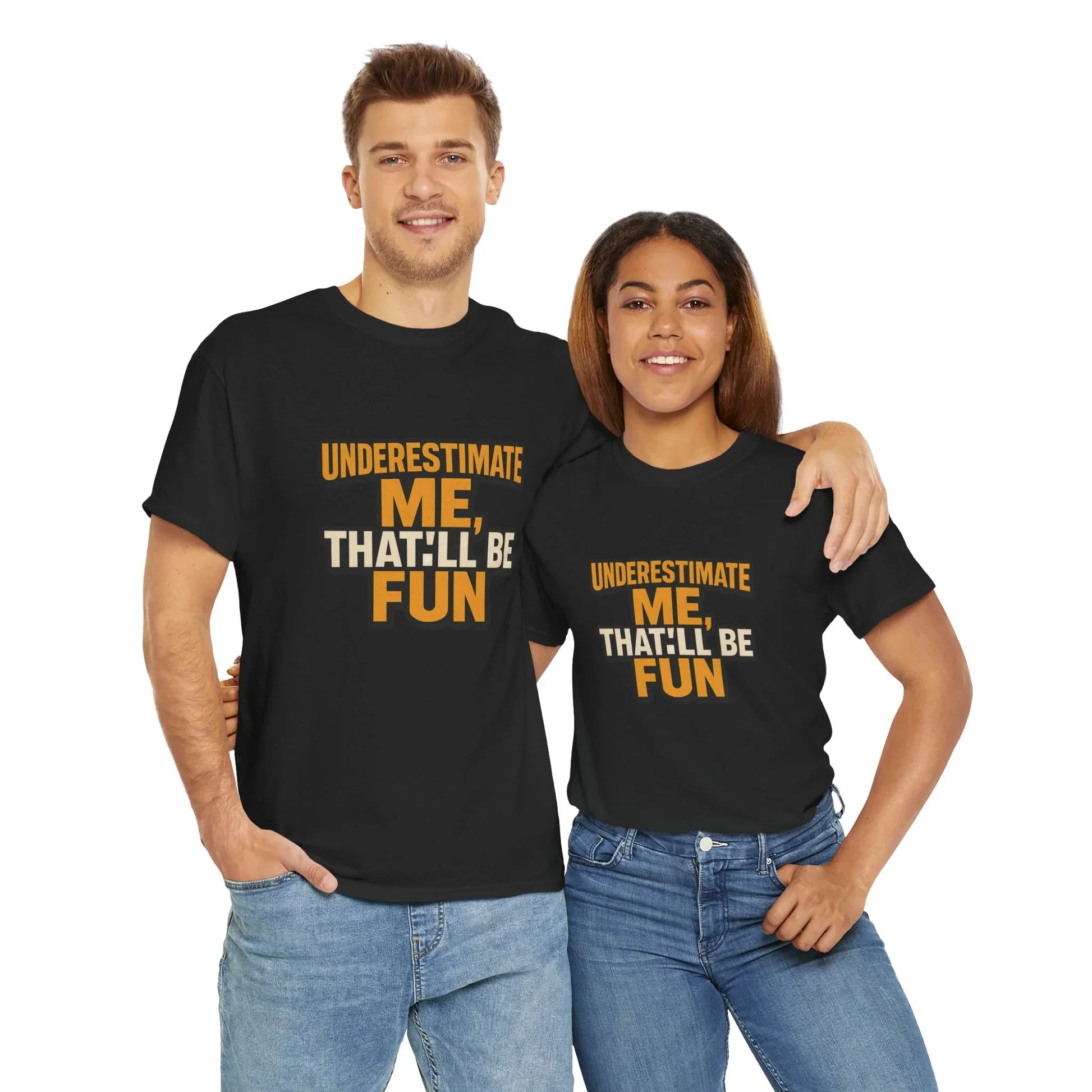Couple in matching black graphic t-shirts with Underestimate Me That'll Be Fun text, white background