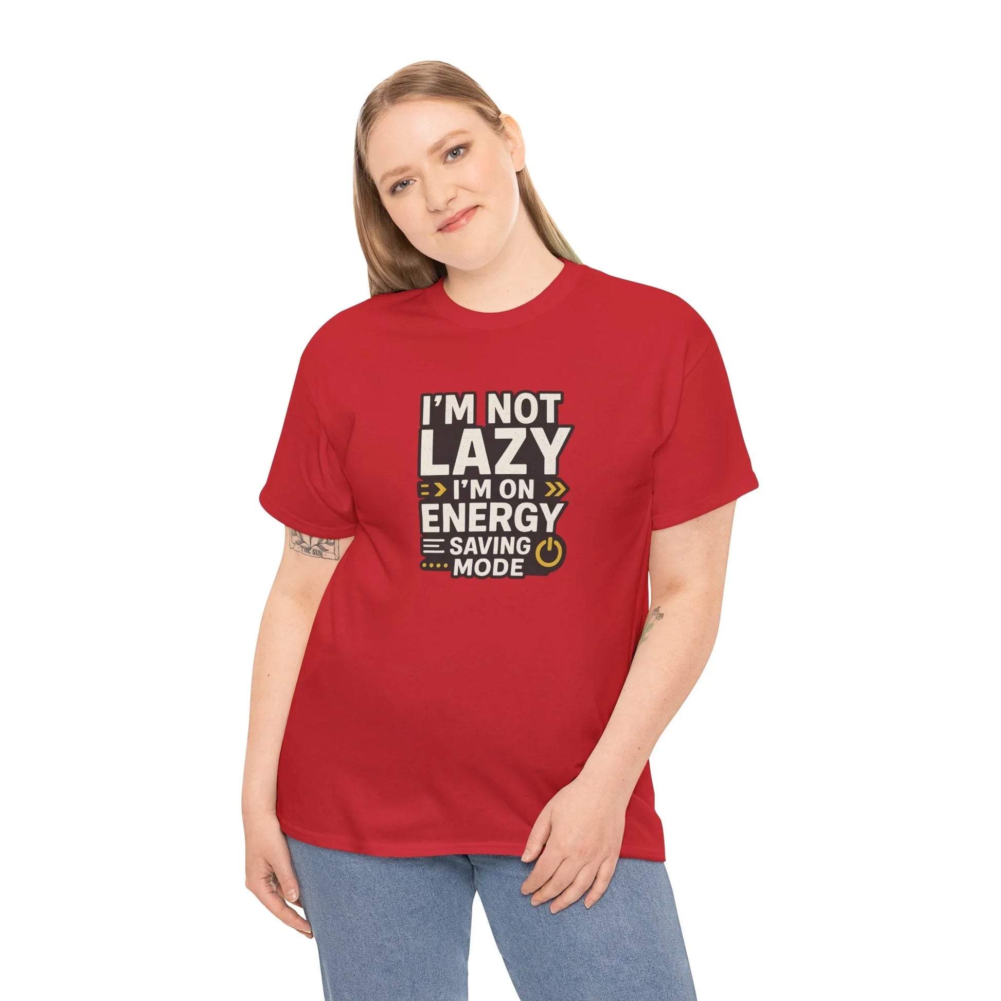 Woman in red graphic t-shirt with 'I'm not lazy, I'm on energy saving mode' text, smiling