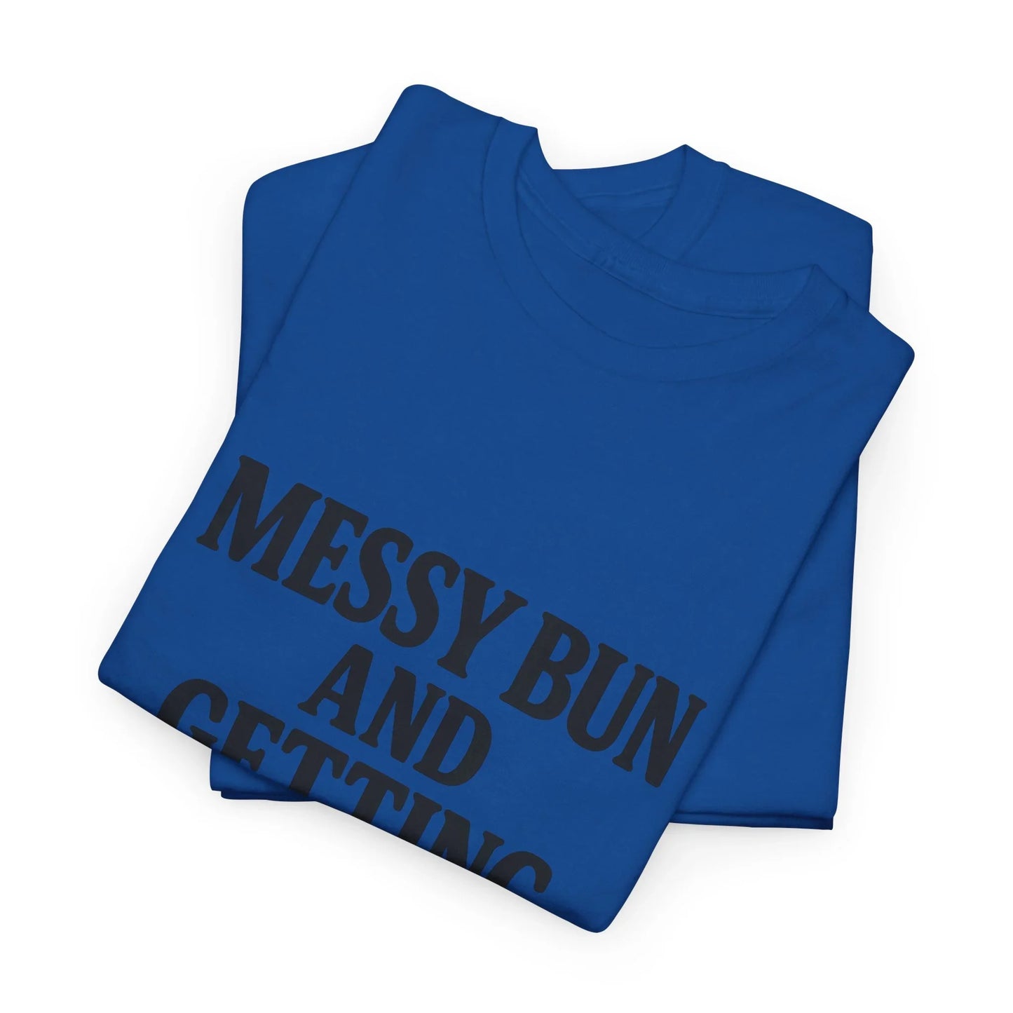 Folded blue t-shirt with bold black text reading 'MESSY BUN AND' on white background