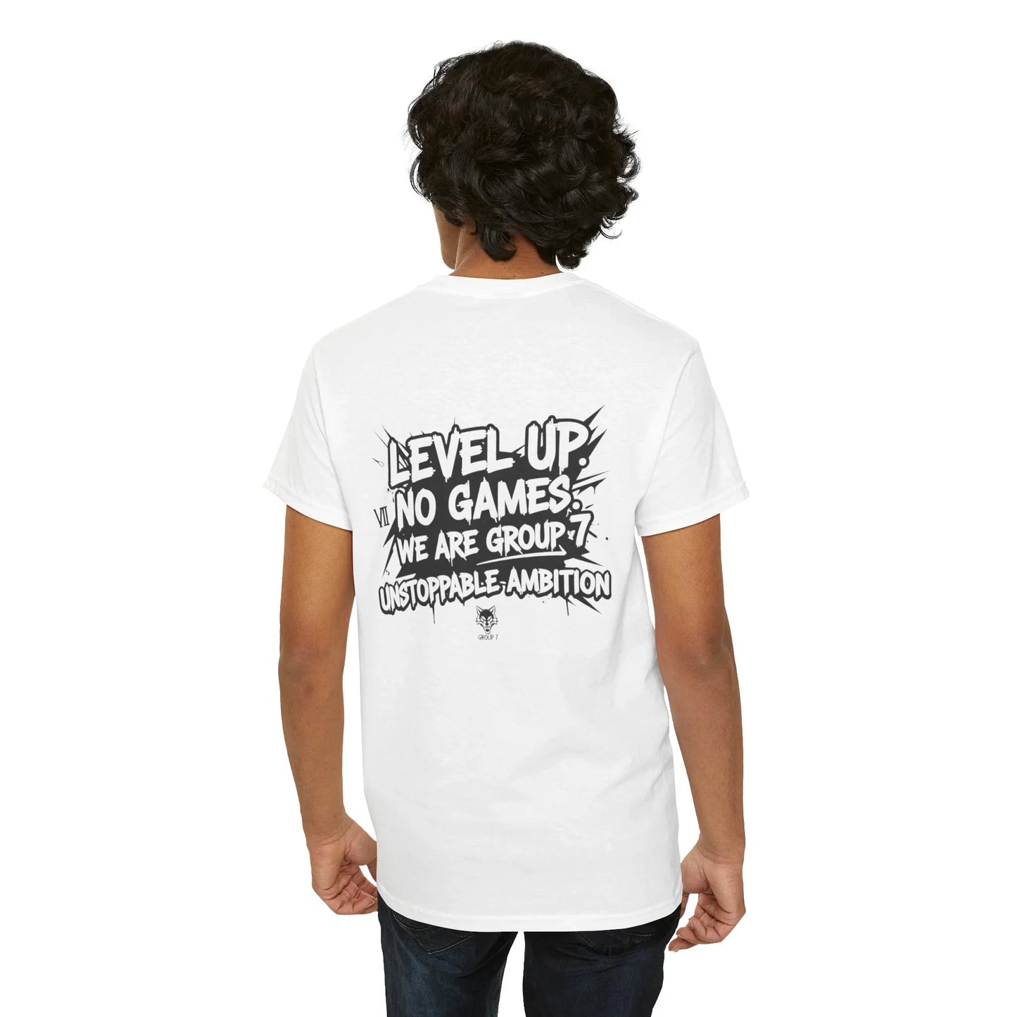Back view of man wearing white graphic t-shirt with 'Level Up No Games Group 7 Unstoppable Ambition' text