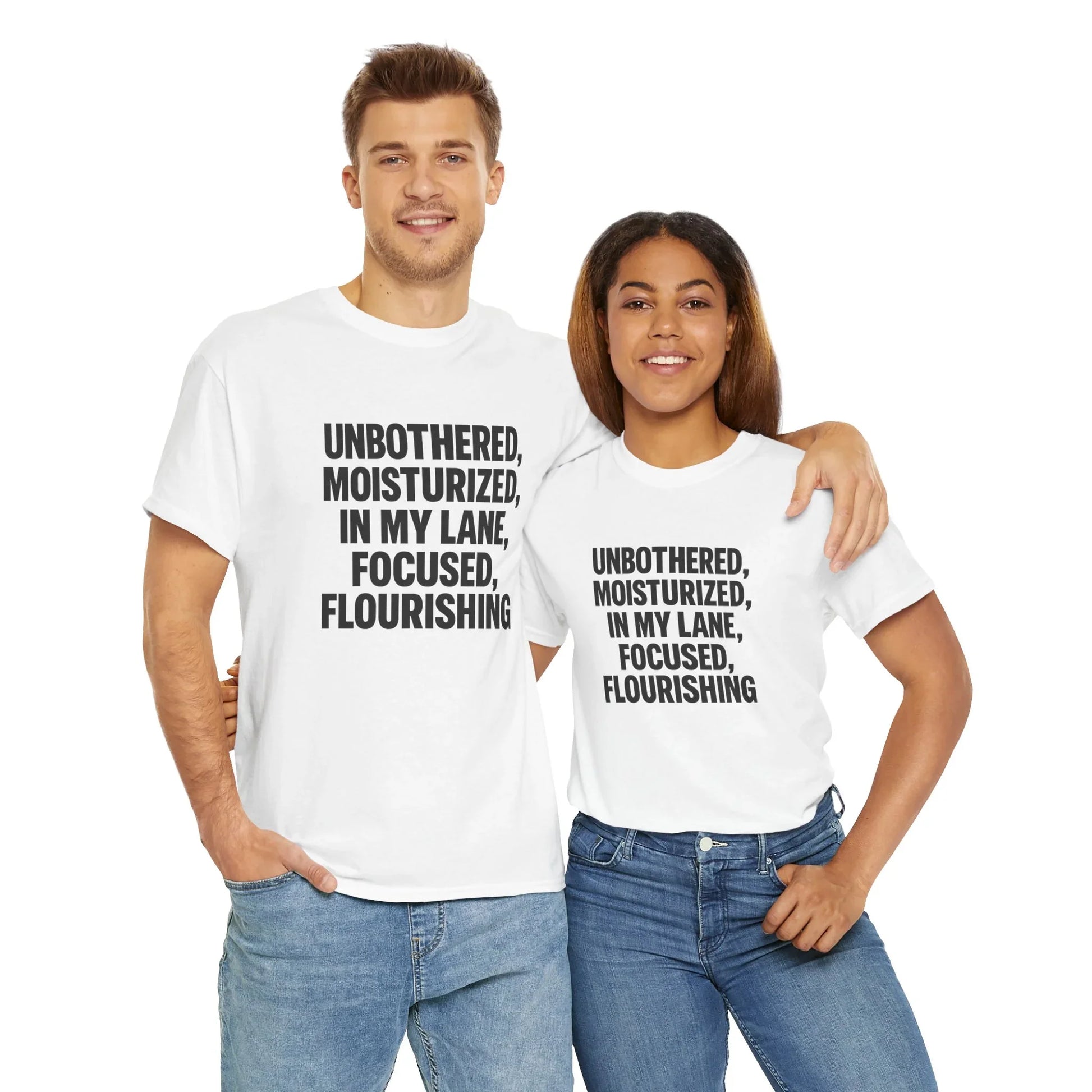 Smiling man and woman in matching white graphic t-shirts and jeans on white background