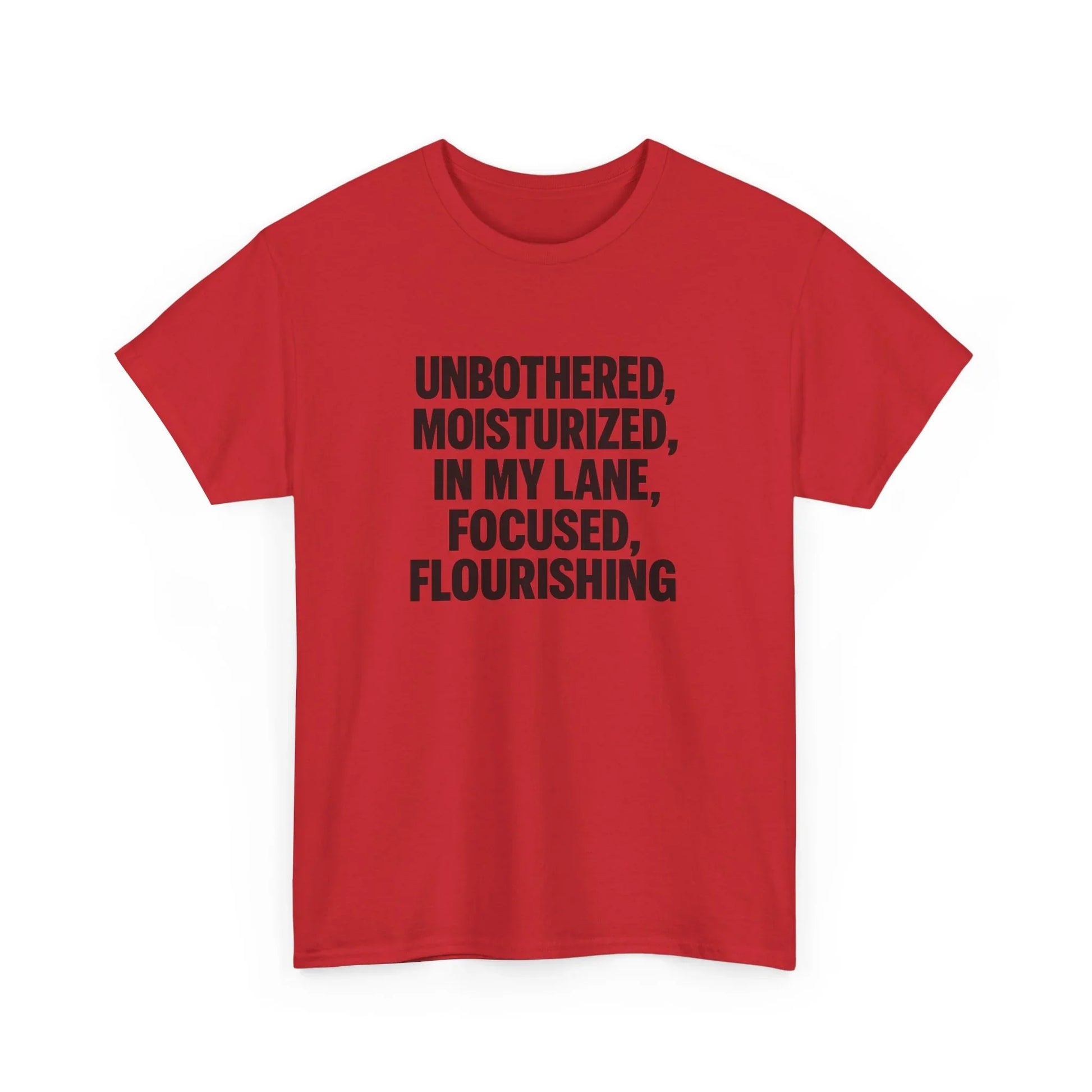 Red graphic t-shirt with bold black text saying Unbothered Moisturized In My Lane Focused Flourishing