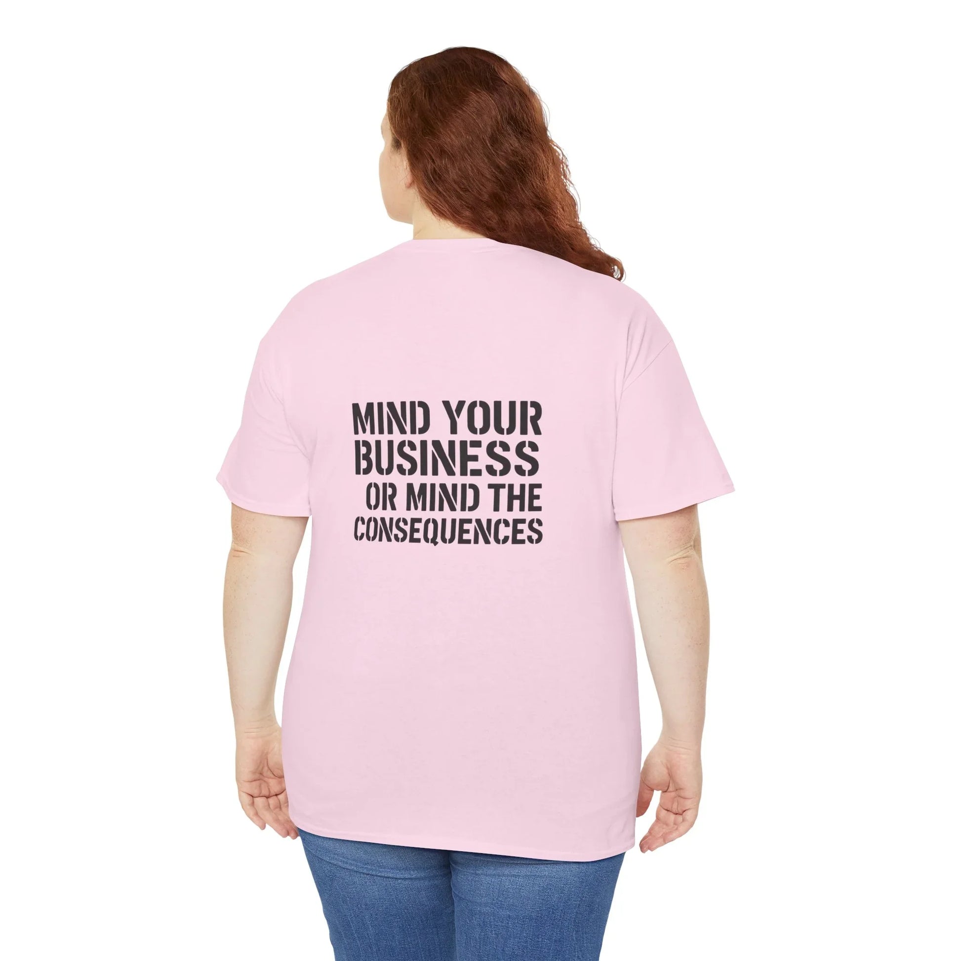 Woman wearing pink t-shirt with 'Mind your business or mind the consequences' slogan