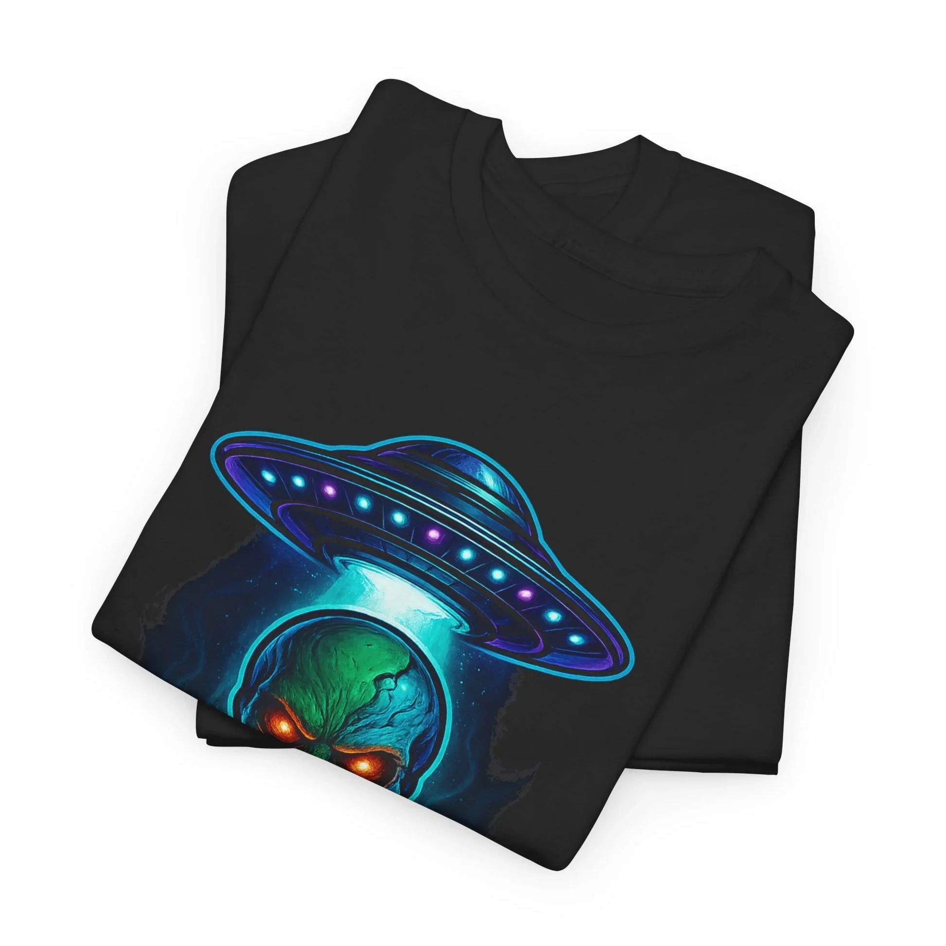 Black t-shirt with neon UFO and alien face graphic, folded on white background