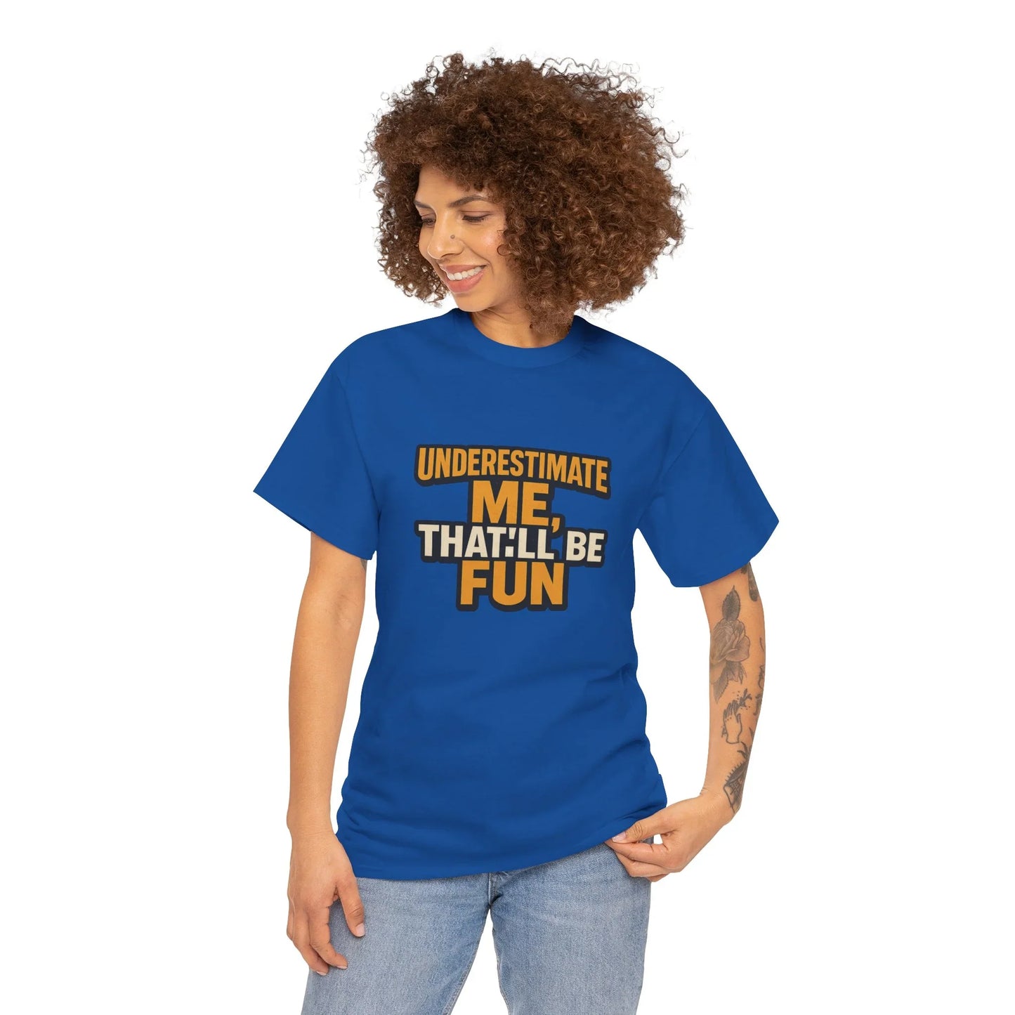 Woman in blue graphic t-shirt with 'Underestimate me, that'll be fun' text, casual style