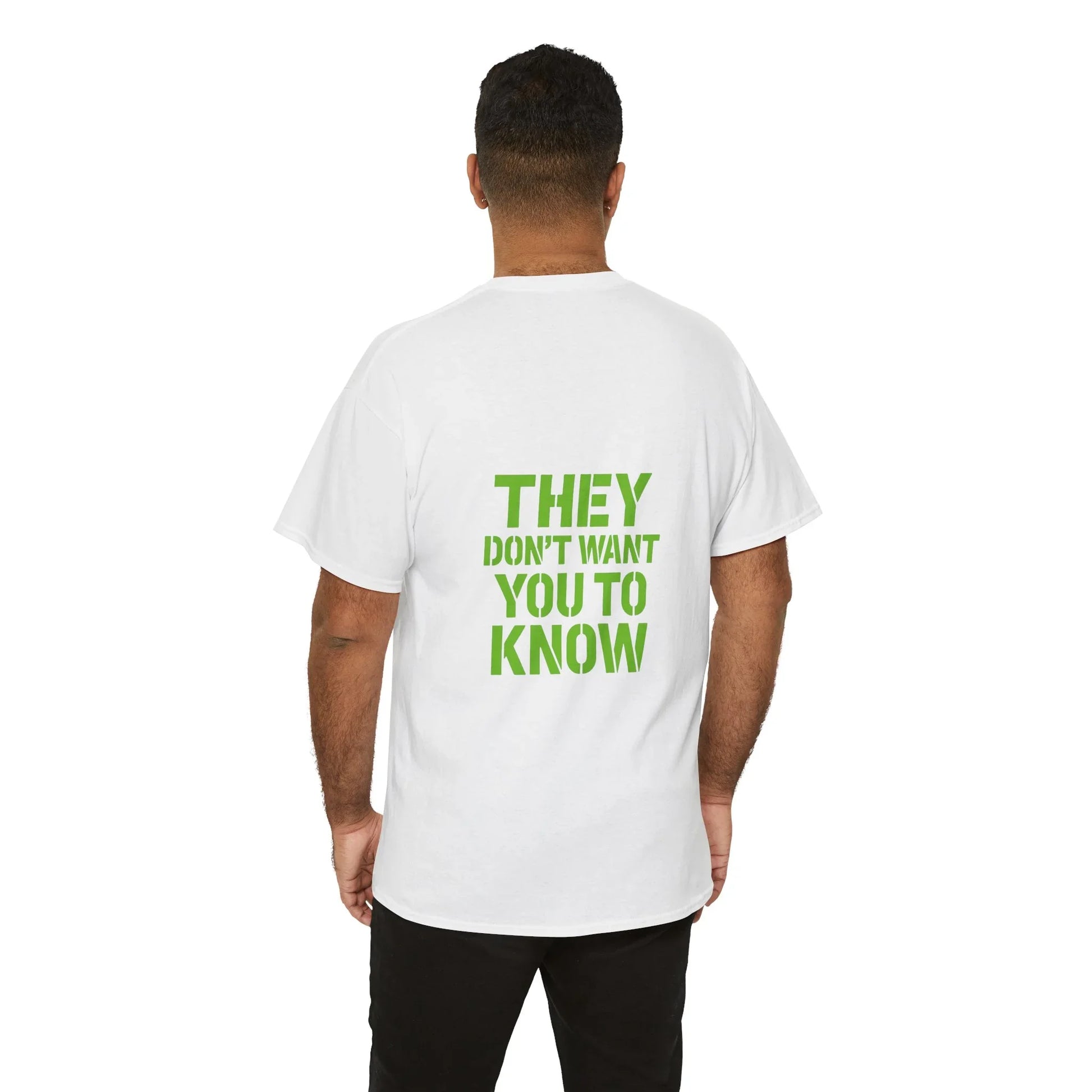 Man wearing white graphic t-shirt with green text 'They don't want you to know' on back