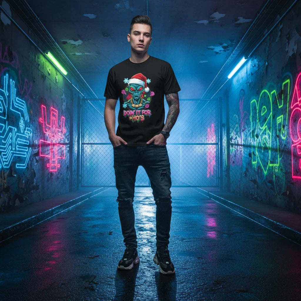 Man wearing graphic Christmas t-shirt with Santa alien design in neon-lit urban alley