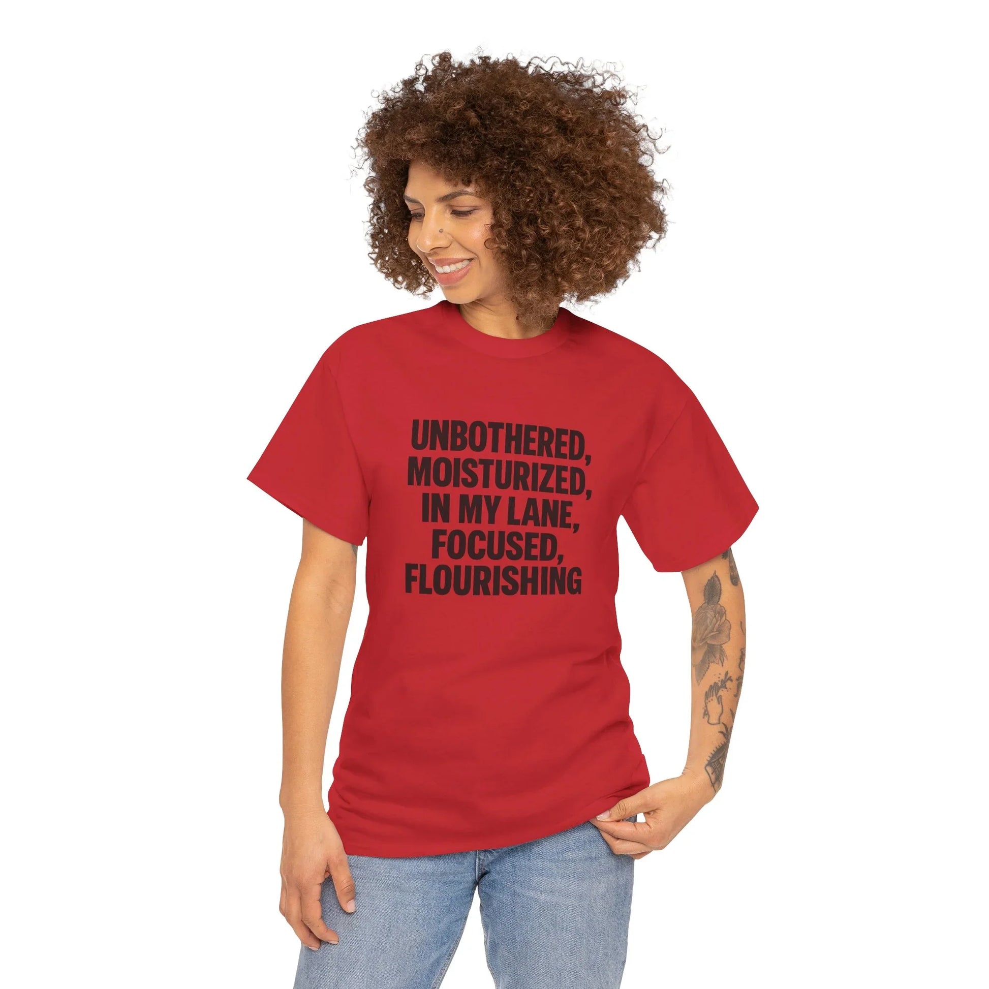 Woman in red graphic t-shirt with motivational quote, casual fashion, curly hair