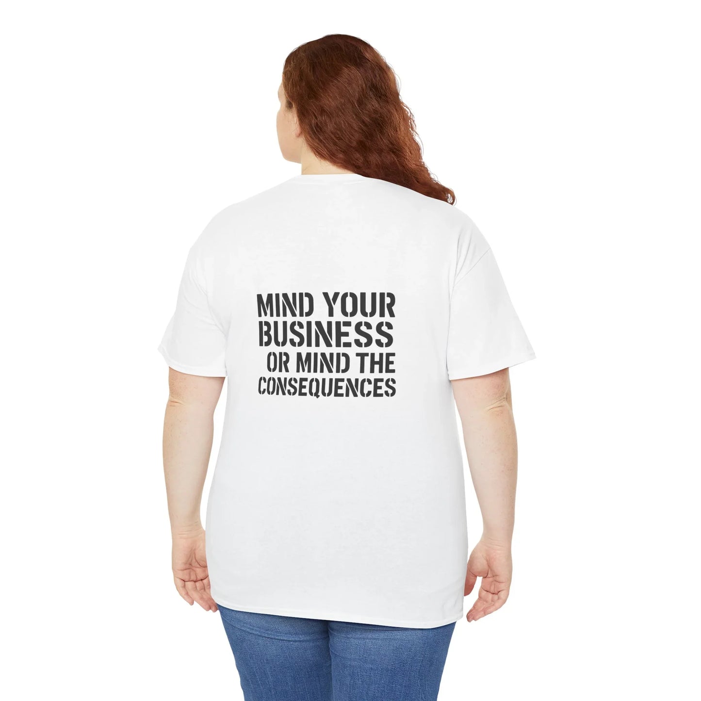 Back view of woman in white t-shirt with bold black 'Mind Your Business or Mind the Consequences' text