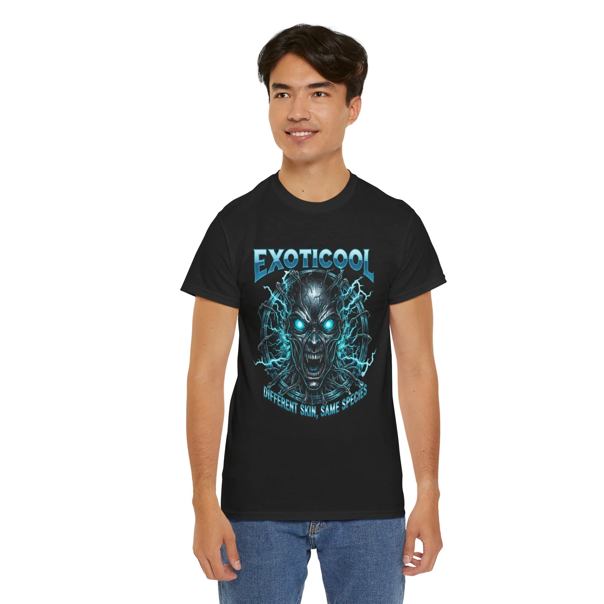 Man wearing black EXOTICOOL t-shirt with glowing blue cyborg skull graphic and jeans