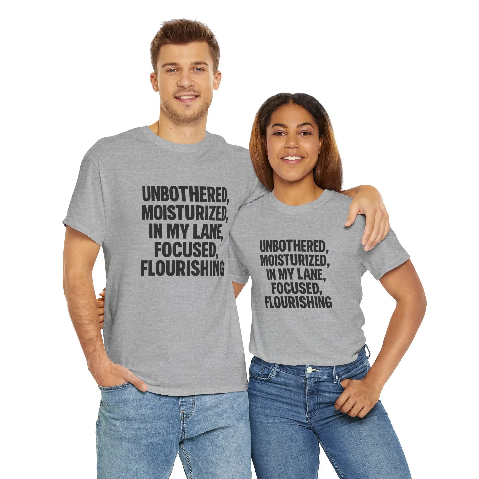 Two people in grey graphic t-shirts with motivational quote, casual fashion, white background
