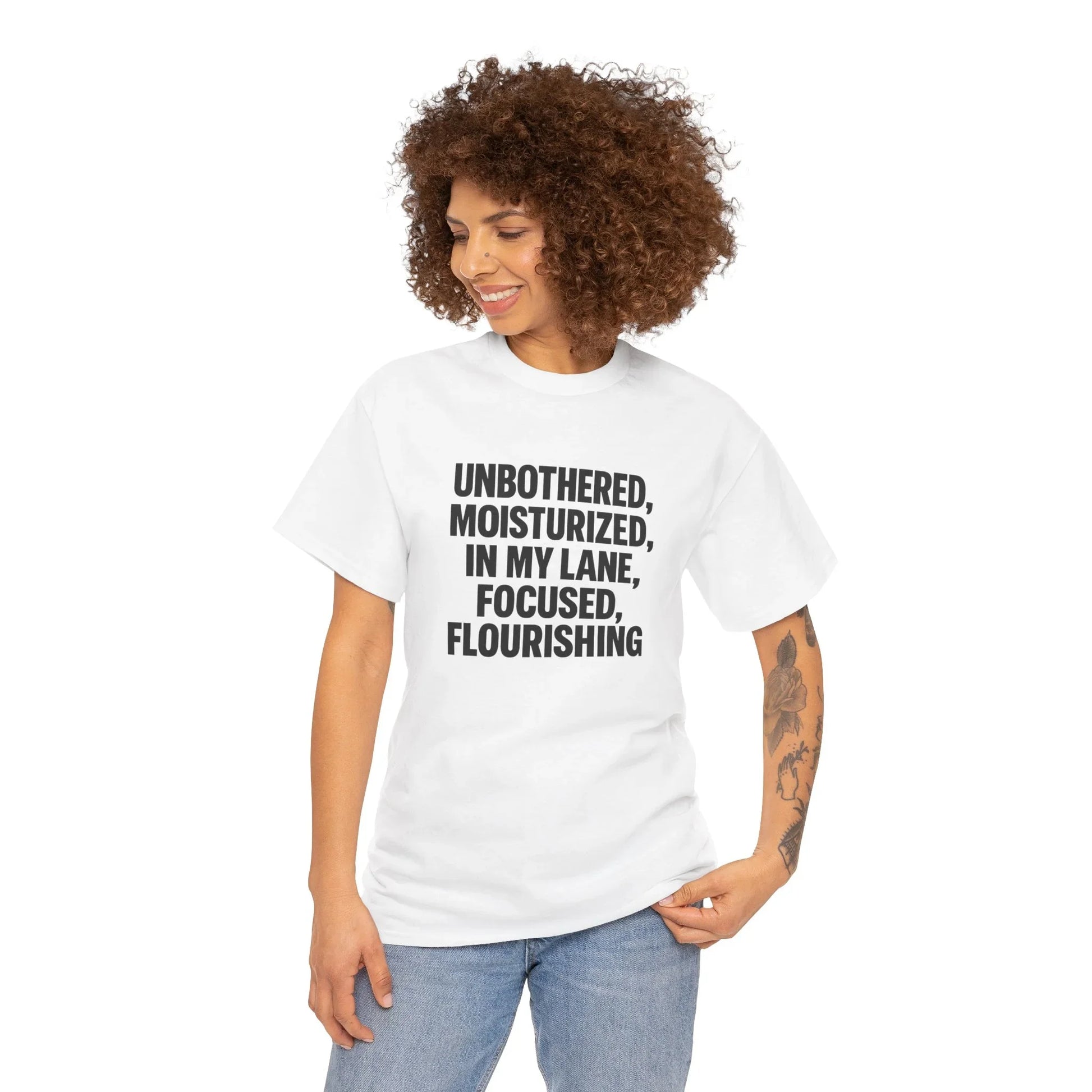 Woman in white graphic t-shirt with positive slogan, casual fashion apparel, curly hair